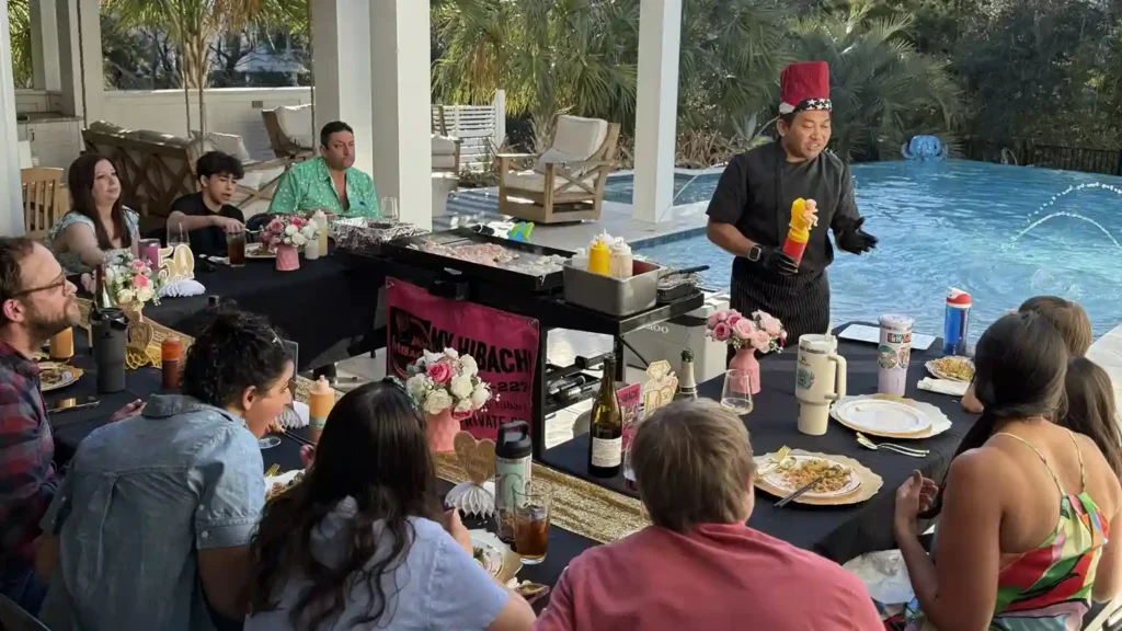 Private hibachi chef performing poolside at a birthday party in 30A