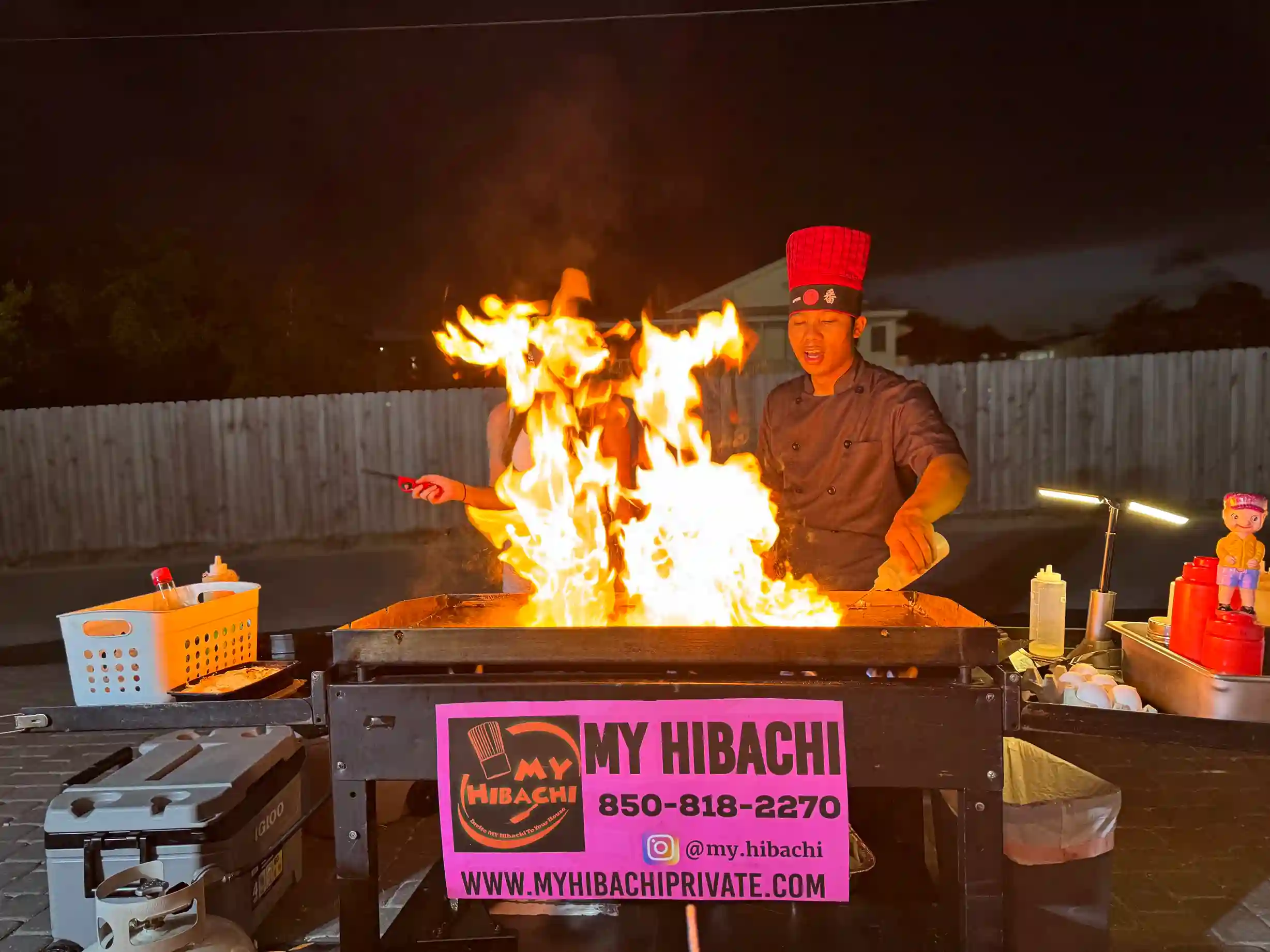 Hibachi chef cooking live for a private party at a beach rental in 30A Florida