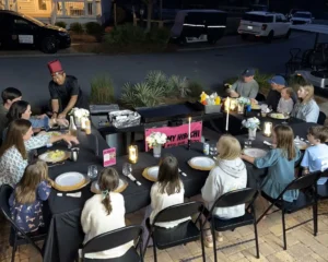 Outdoor hibachi chef grilling for a backyard dinner party in Florida