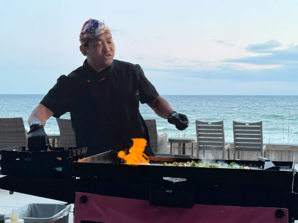 Private hibachi chef cooking in Inlet Beach with live fire show and child guest