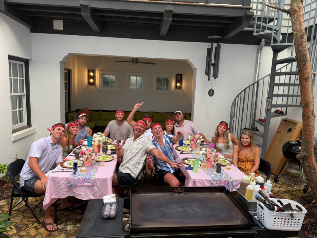 Guests enjoying a backyard hibachi party in Florida with a private chef