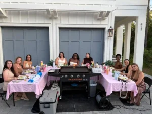 Private hibachi chef catering event on 30A with guests enjoying a backyard dining experience